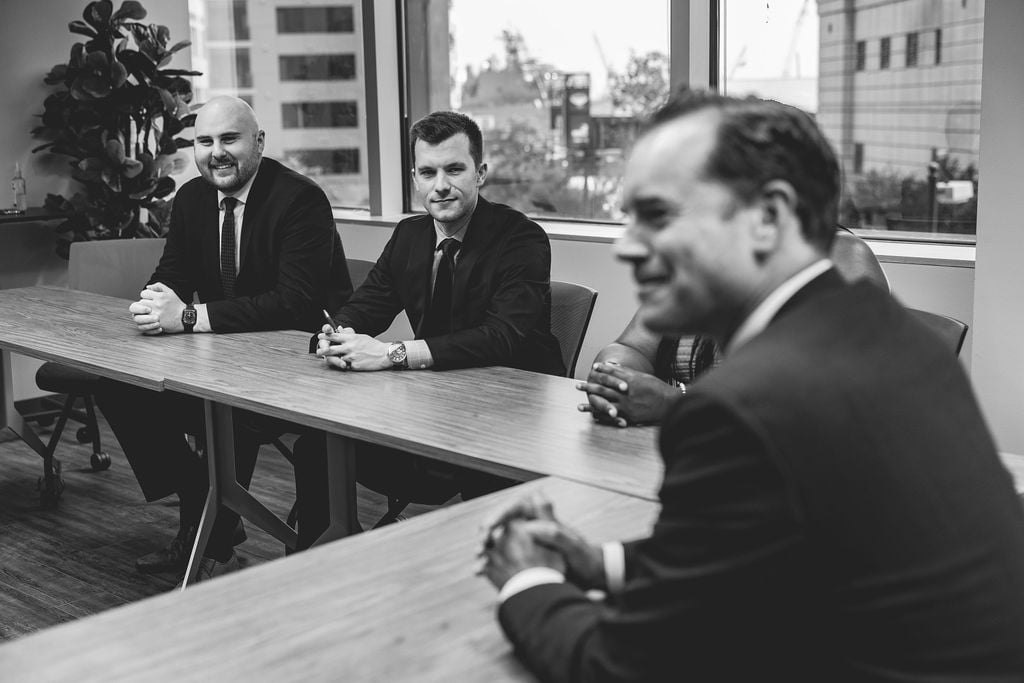 Attorneys of Med Contract Law meeting at a conference table in the firm's office