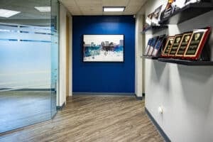 Medical Practice Transaction Attorneys 3 Hallway in the McCormick Law & Consulting office with framed art and award plaques
